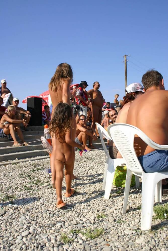 Naturist Standing Sideline - Popularizing nudism among the general public