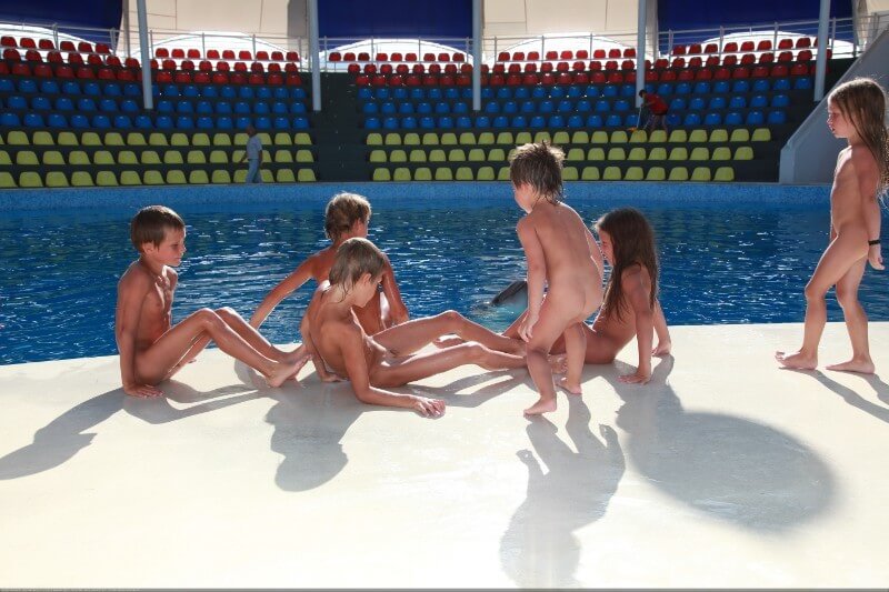 Swimming dolphins photo gallery - Growing up on a nudist beach