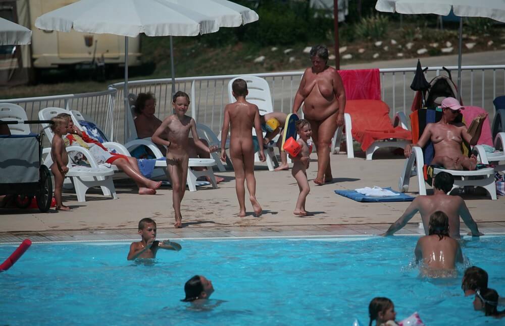Naturist Afternoon Pool Games pics - Nudity is considered a natural part of human life